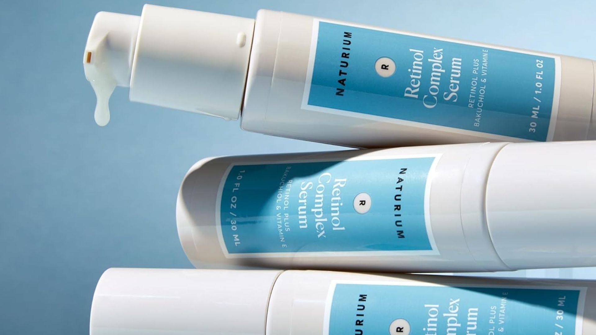 Three bottles of Naturium retonol stacked on top of each other.