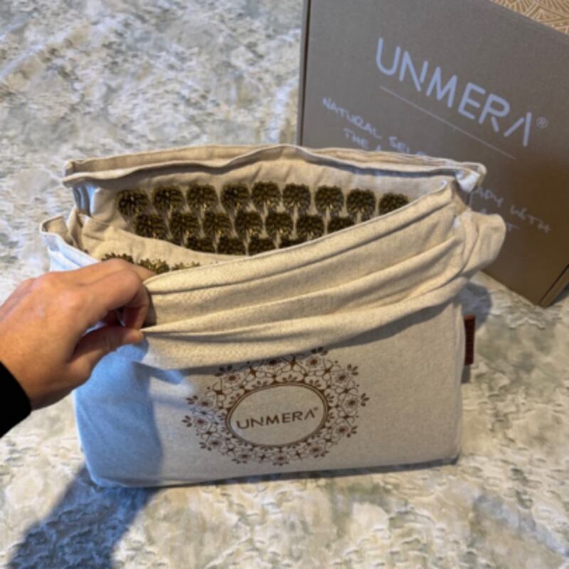 Acupressure mat in its carrying bag