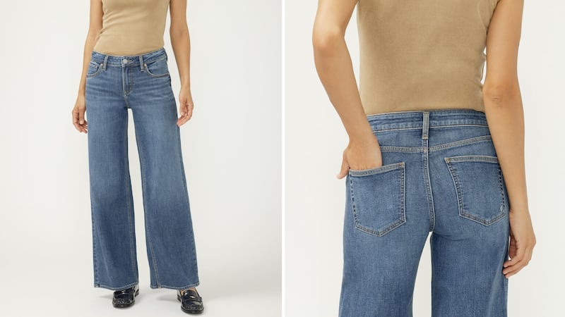 A person wearing  Suki Mid Rise Wide Leg Knit Flex Jeans.