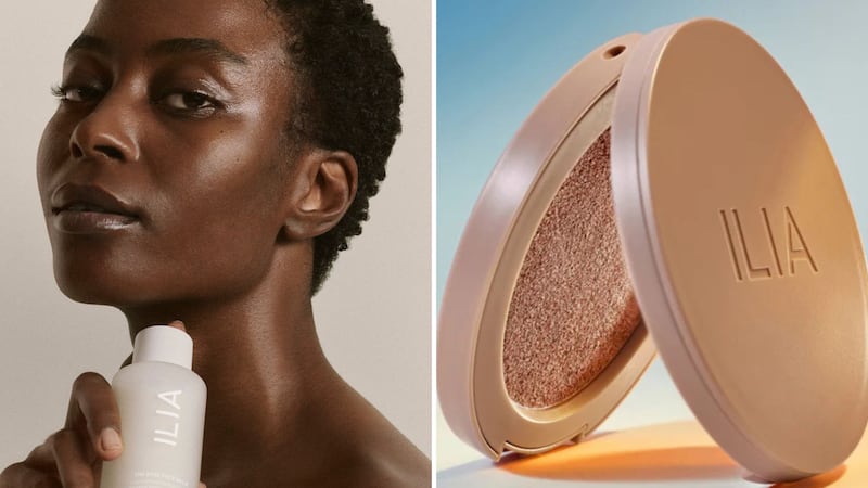 A person holding an ILIA primer and an open ILIA bronzer compact.