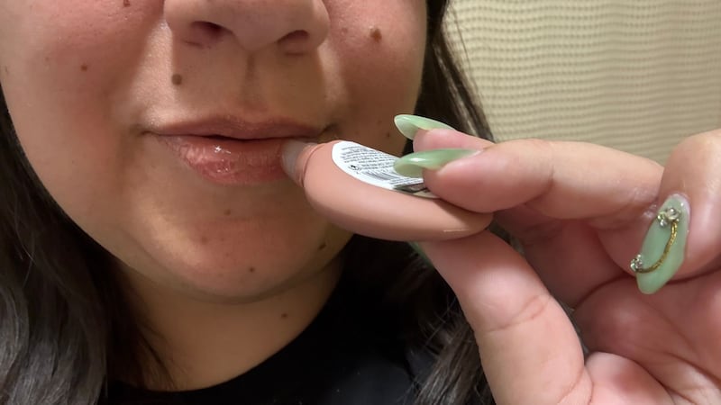 Bianca applying the NYX Smushy SOS Hydrating Lip Mask to her lips