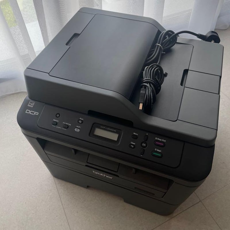 the printer on a floor of a home