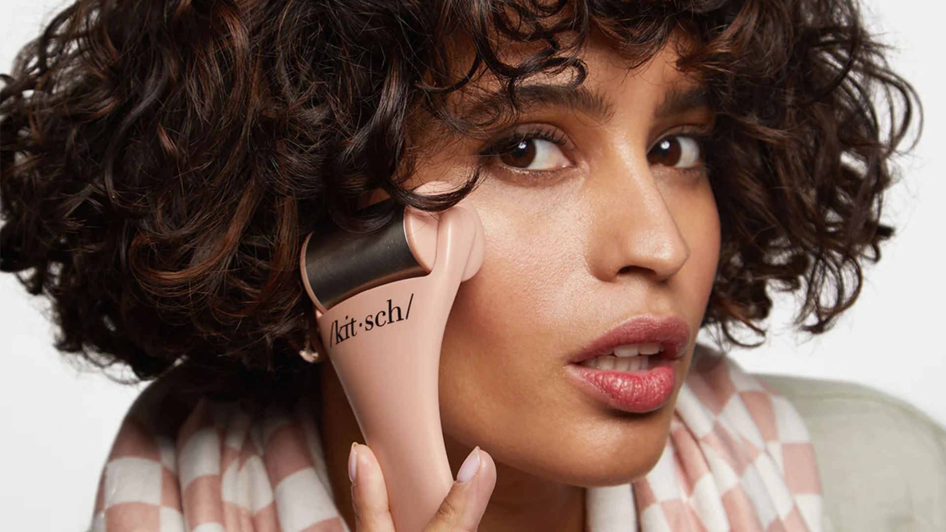 A person using an ice roller.