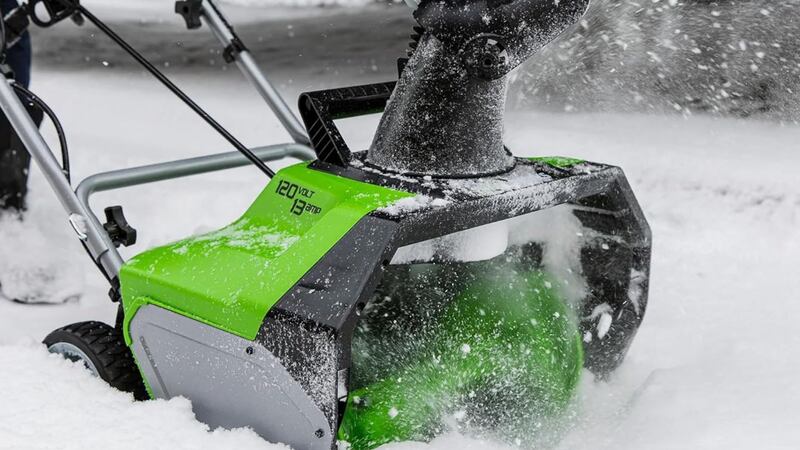 A close-up of the deck of a snow blower.