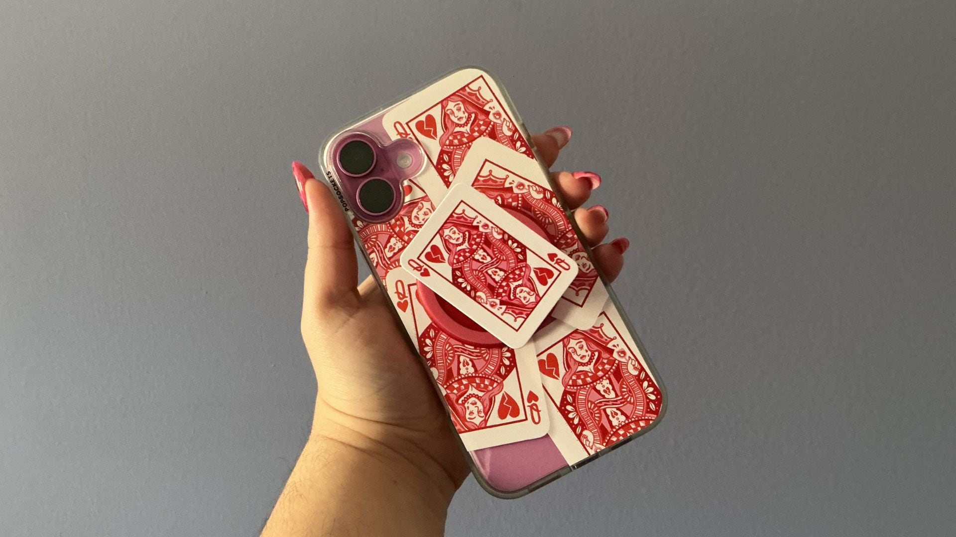 Bianca holding her phone up