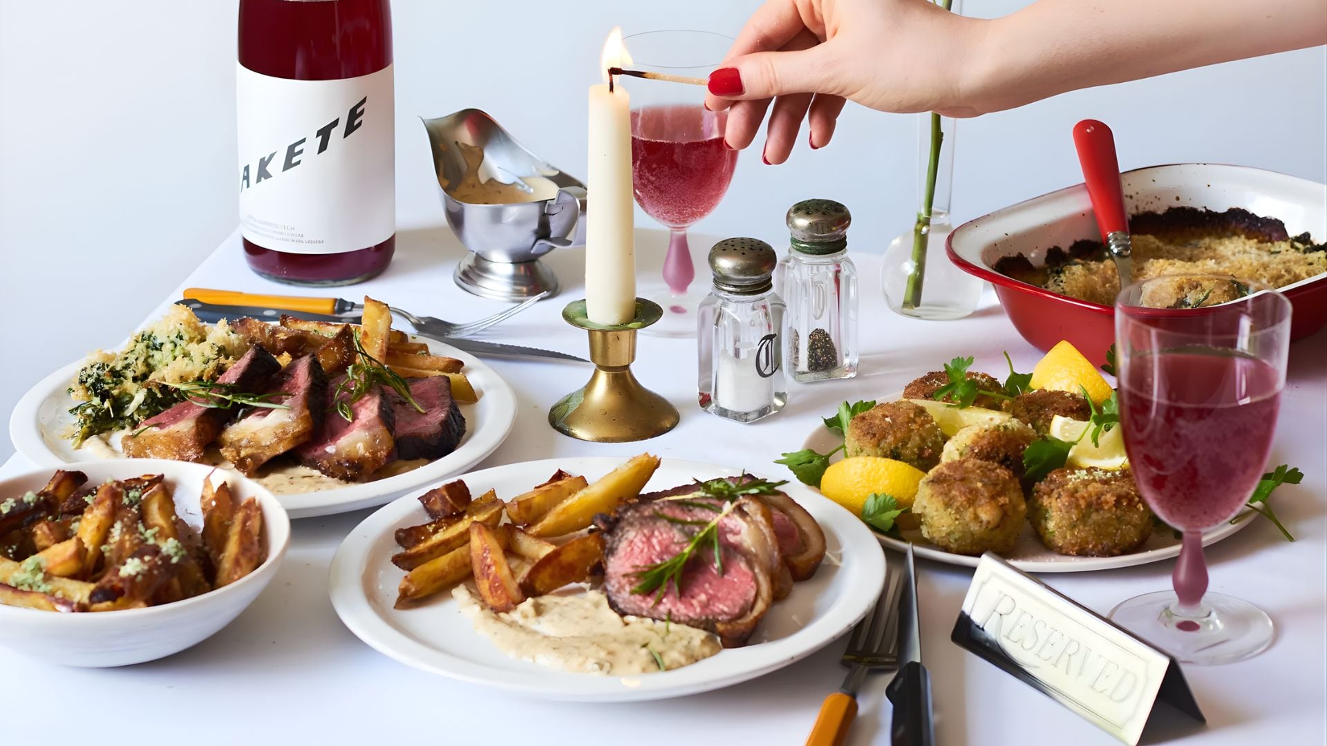 a fancy table setting with a nice meal on plates