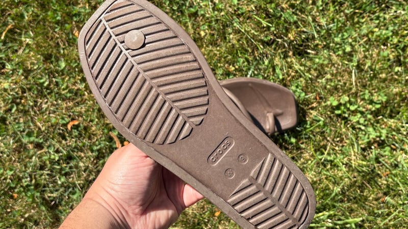 Bianca showing the tread on the bottom of the sandals.
