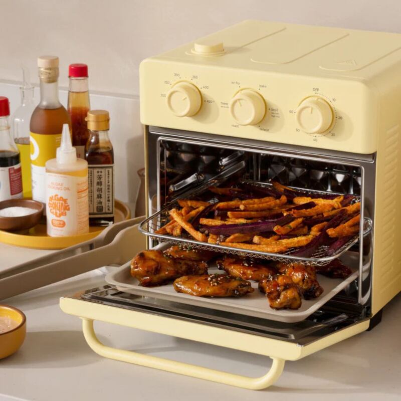 Fries and chicken wings in a butter yellow Wonder Oven.