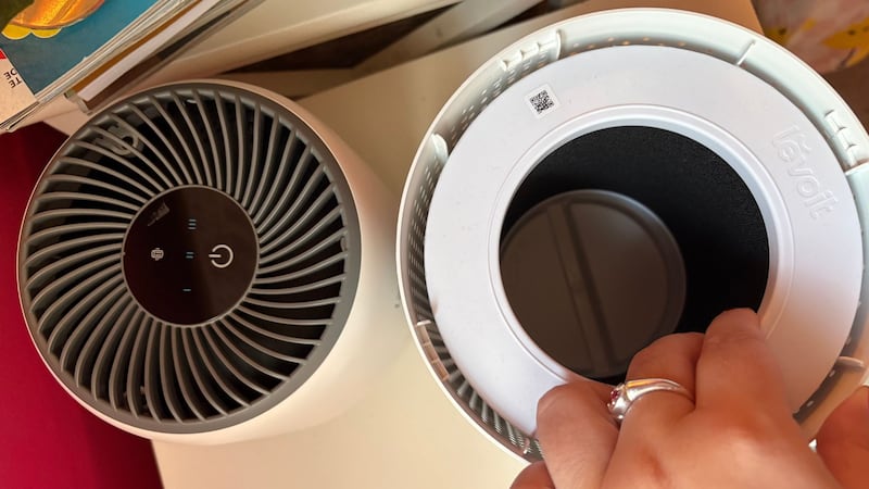 Bianca demonstrating how easy it is to change the filter out of the air purifier