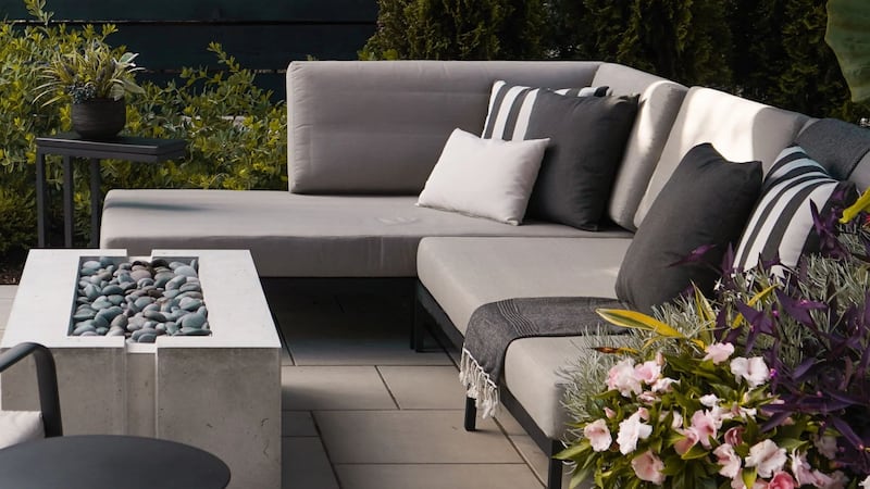 an outdoor sectional in a garden