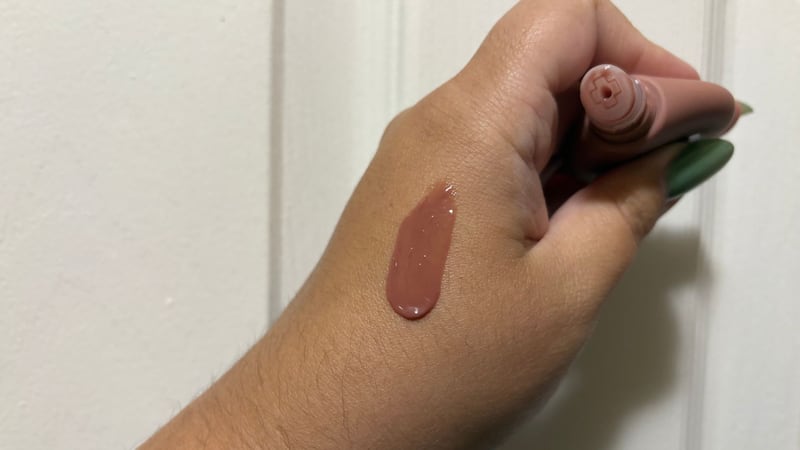 A swatch of the NYX Smushy SOS Hydrating Lip Mask in Shea So Smooth on Bianca's skin