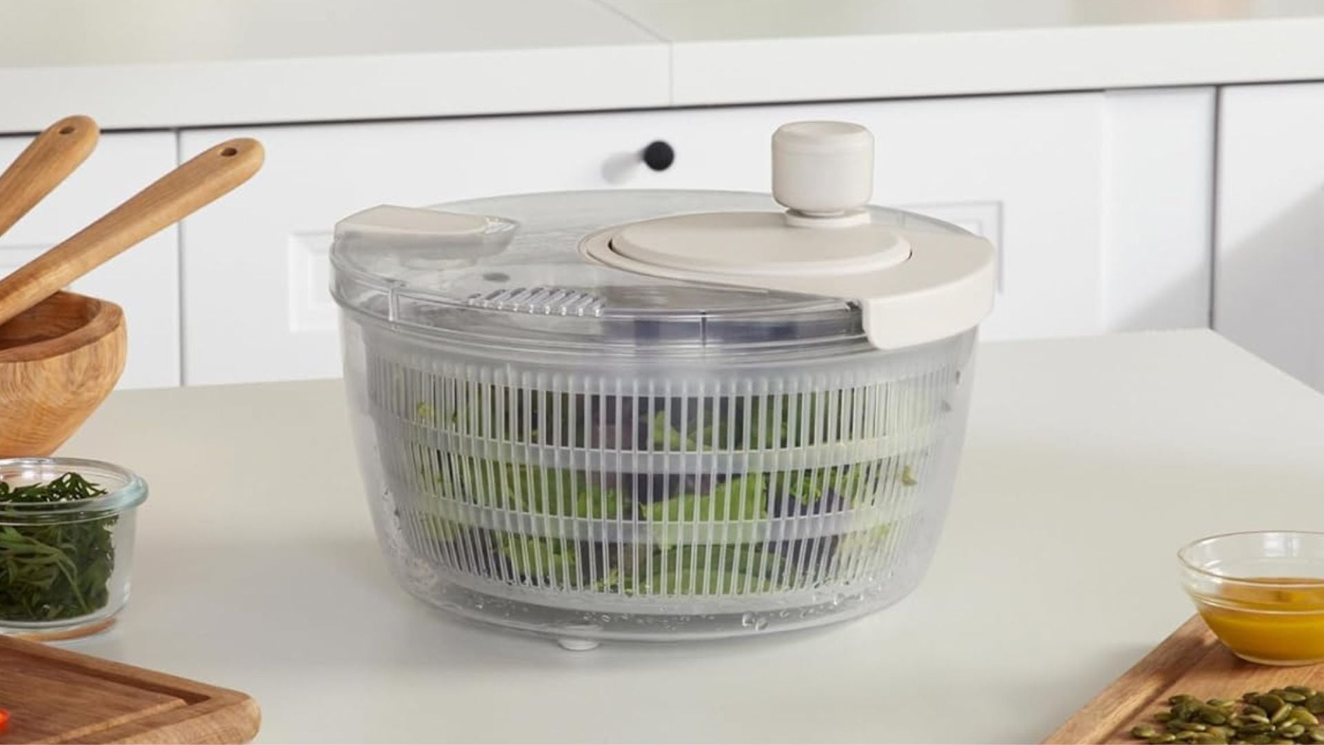 a salad spinner on a marble counter in a kitchen
