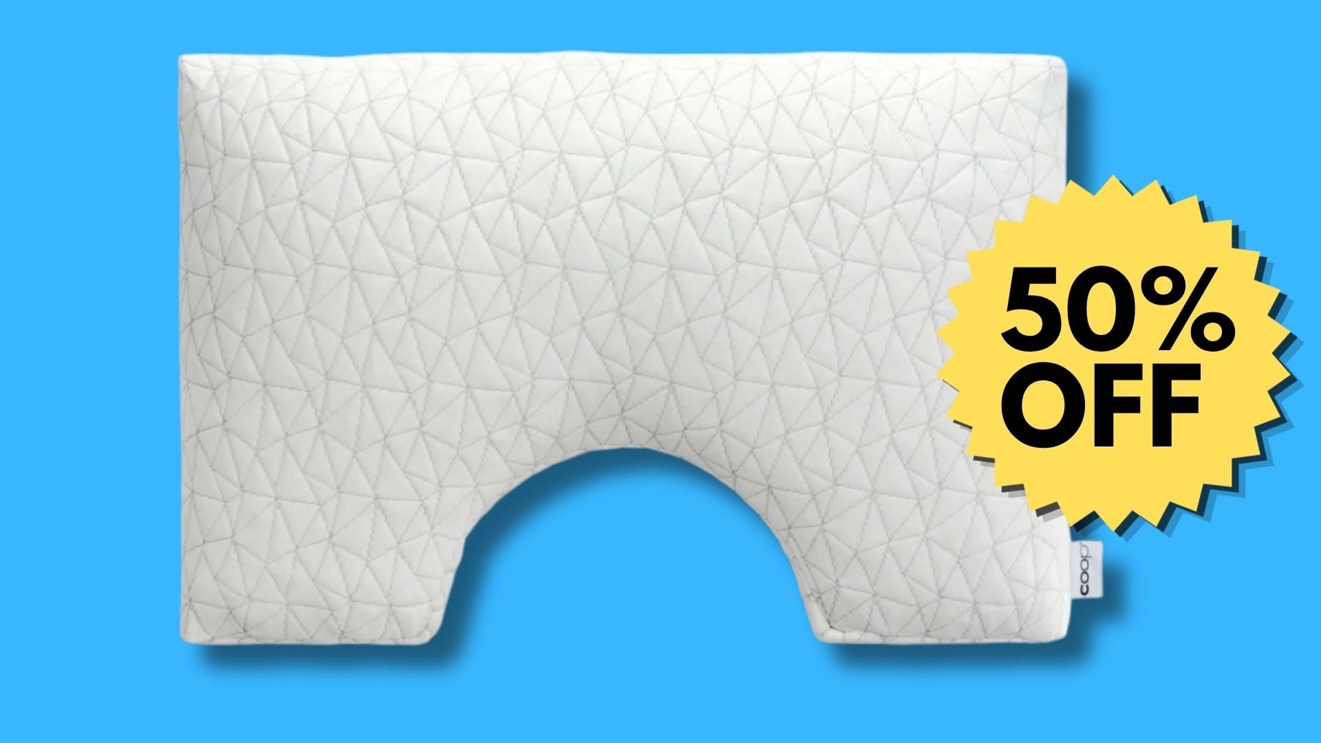 A Coop side sleeper pillow on a blue background.