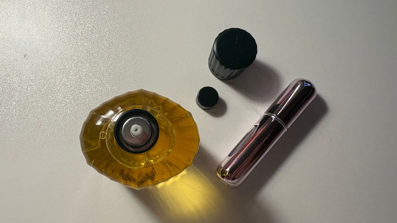 Bianca's perfume with the nozzle taken off, ready to fill the mini atomizer