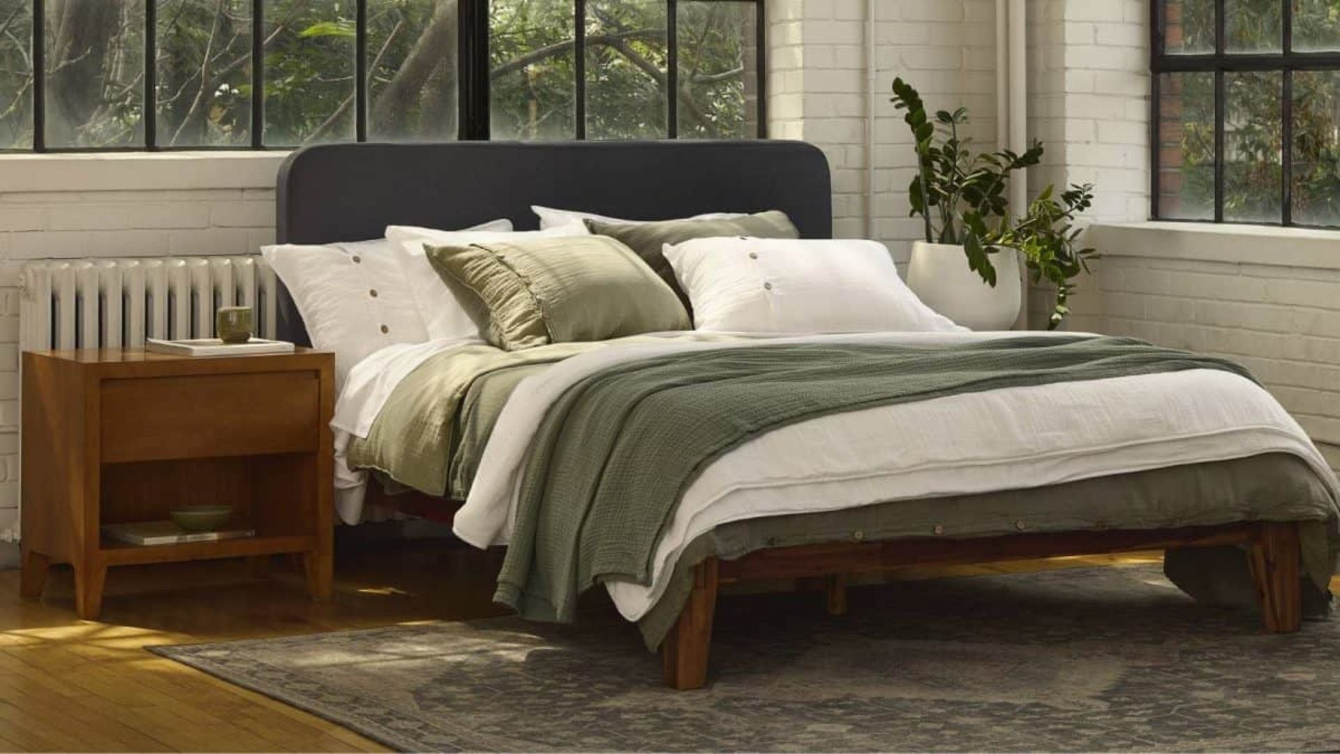 A bed with Silk & Snow bedding on it.