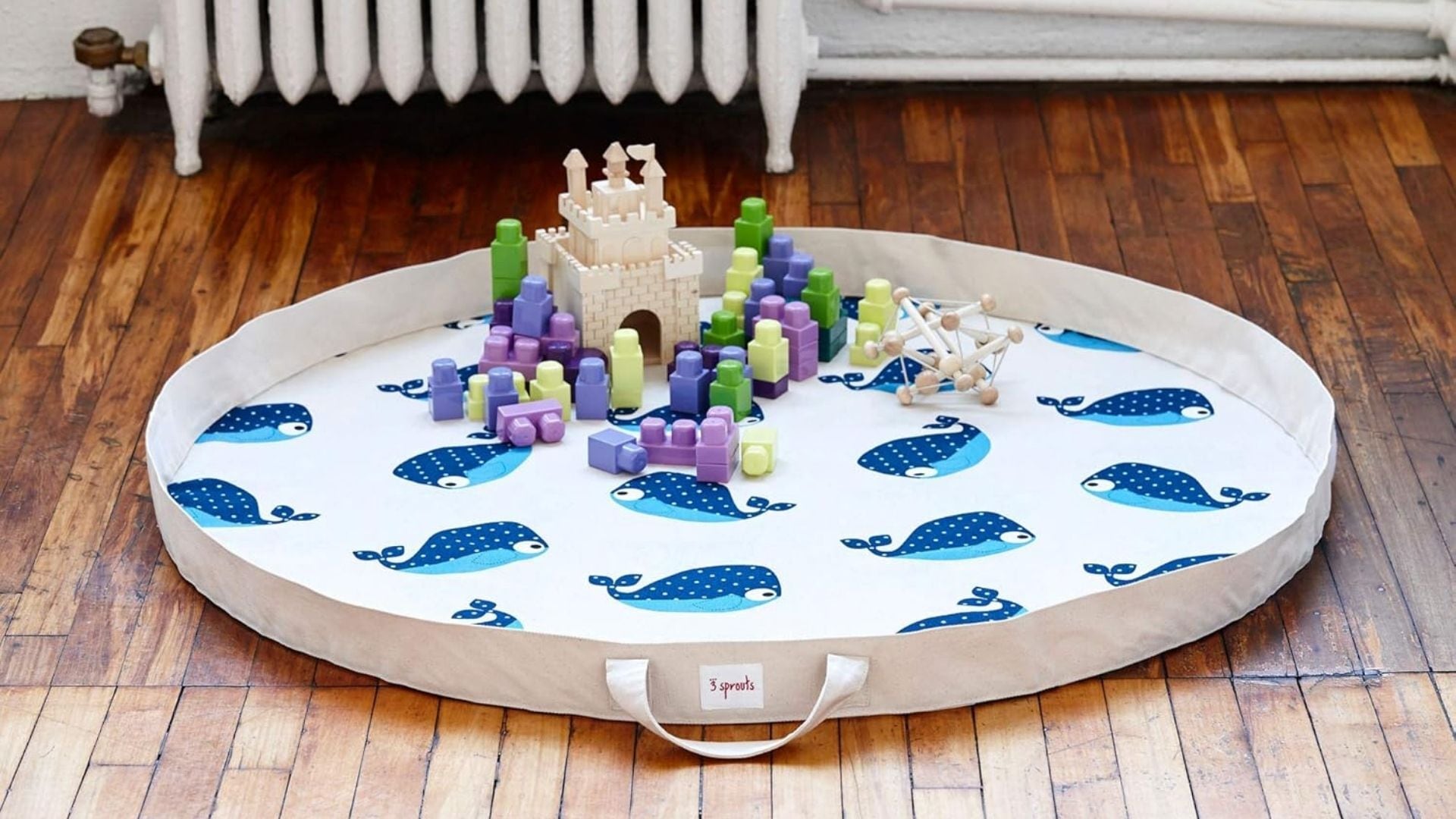 a toy mat storage bag on a hardwood floor