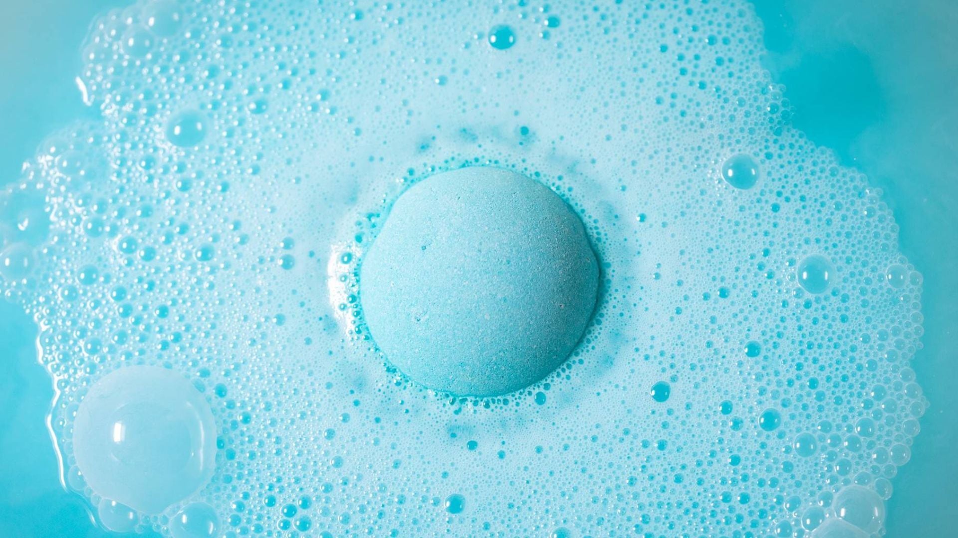 a bath bomb fizzing in the water