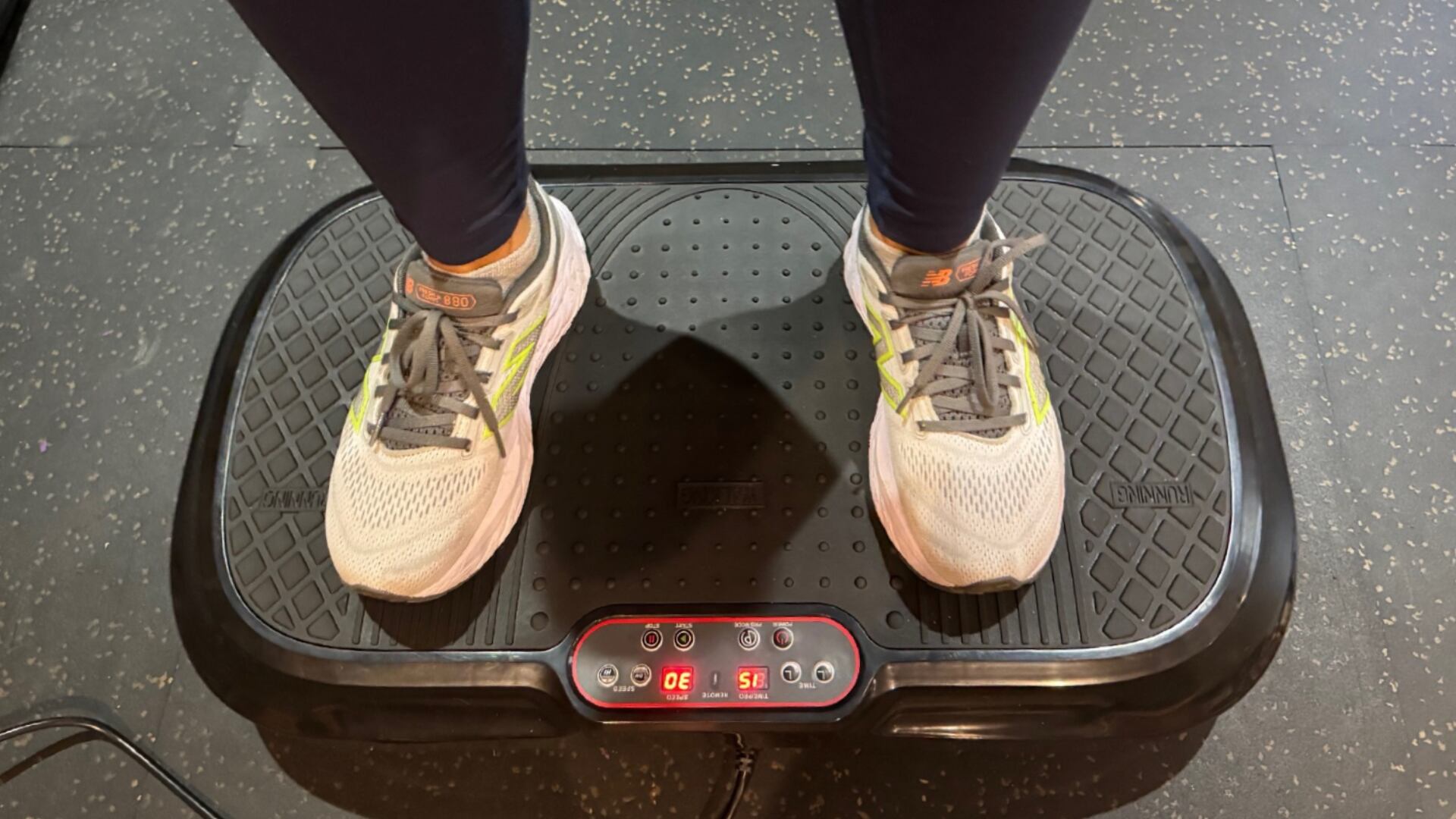 Valérie Sardin standing on the Lifepro Waver Vibration Plate
