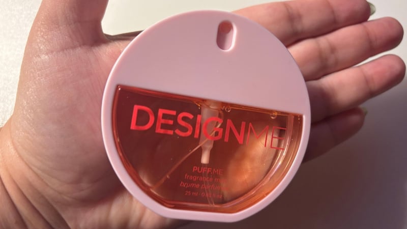 The compact bottle fits in the palm of Bianca's hand