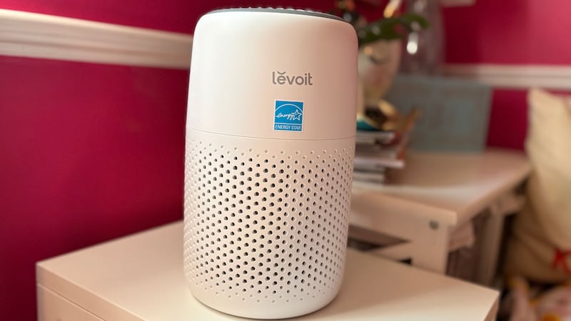 The air purifier on a table by a window