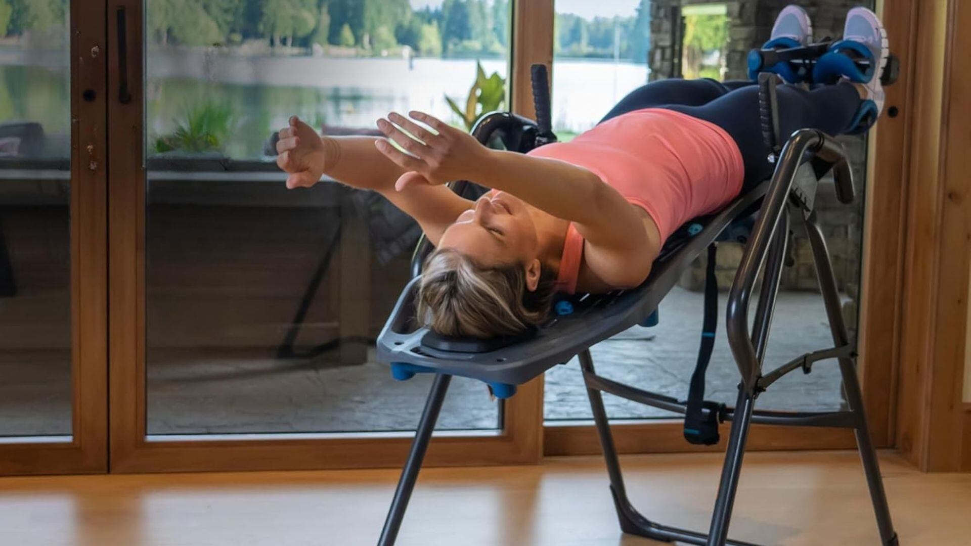 A person lying on an inversion table.