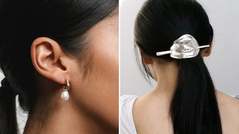 A person wearing Wolf Circus earrings and a person wearing a Wolf Circus hair clip.