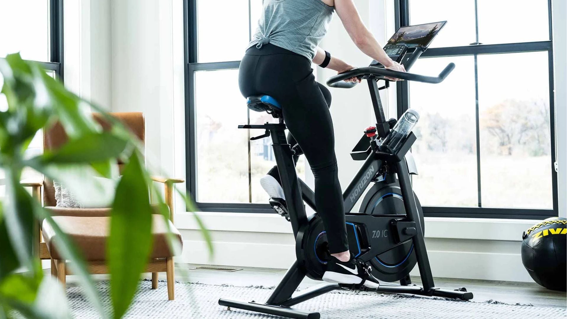 A person riding a Horizon Fitness bike.