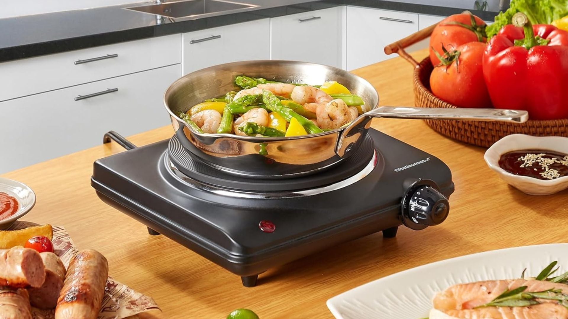 A stir fry in a pan on top of the Elite Gourmet hot plate.