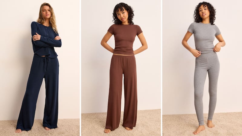 Three models wearing loungewear outfits from Simons.