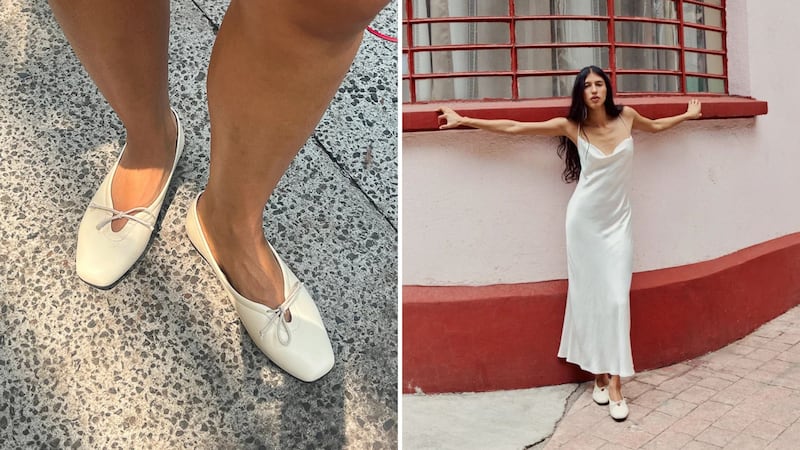A person wearing white Maguire ballet flats.