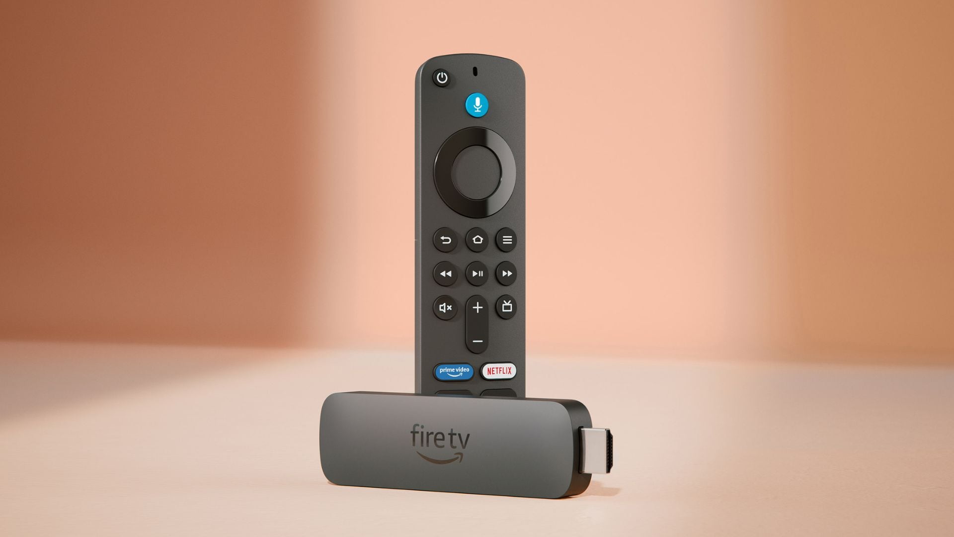 A Fire TV Stick on a peachy-pink background.
