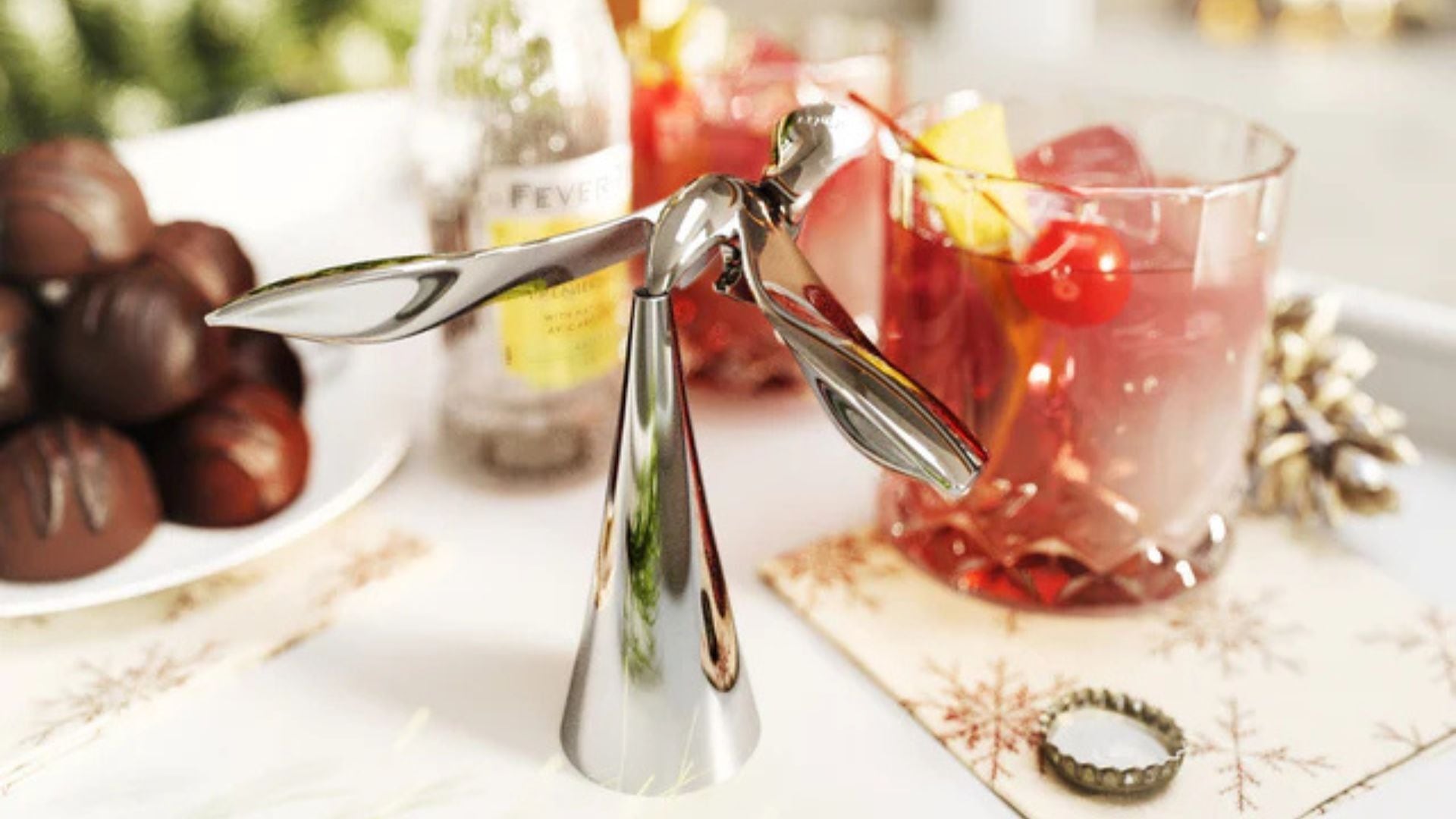 the bird shaped bottle opener on a festive table