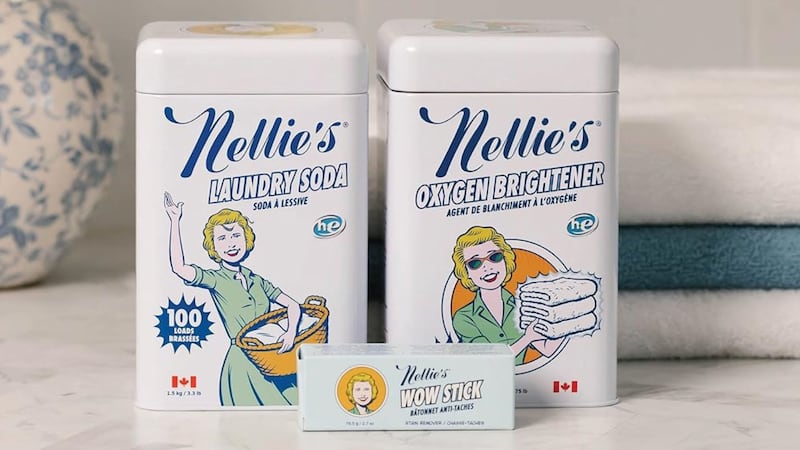 two tins of the cleaning solution on a laundry room counter