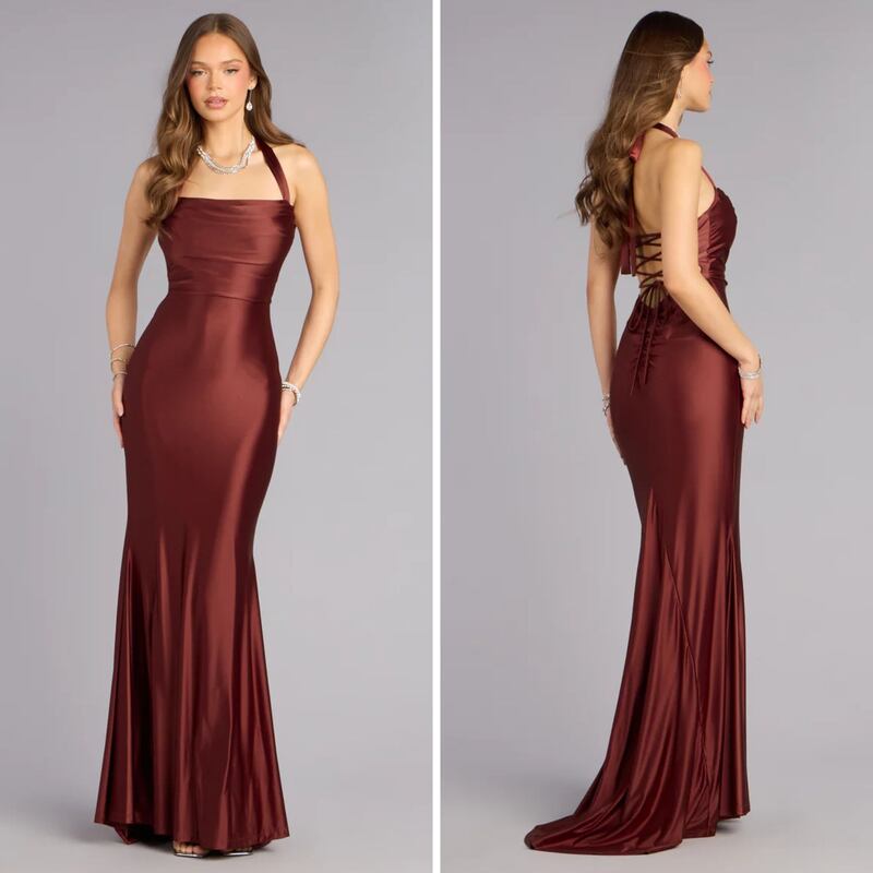 A person wearing a burnt orange halter dress from Windsor.