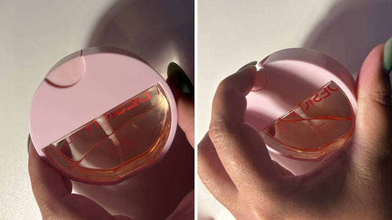 Bianca showing the back of the fragrance mist bottle