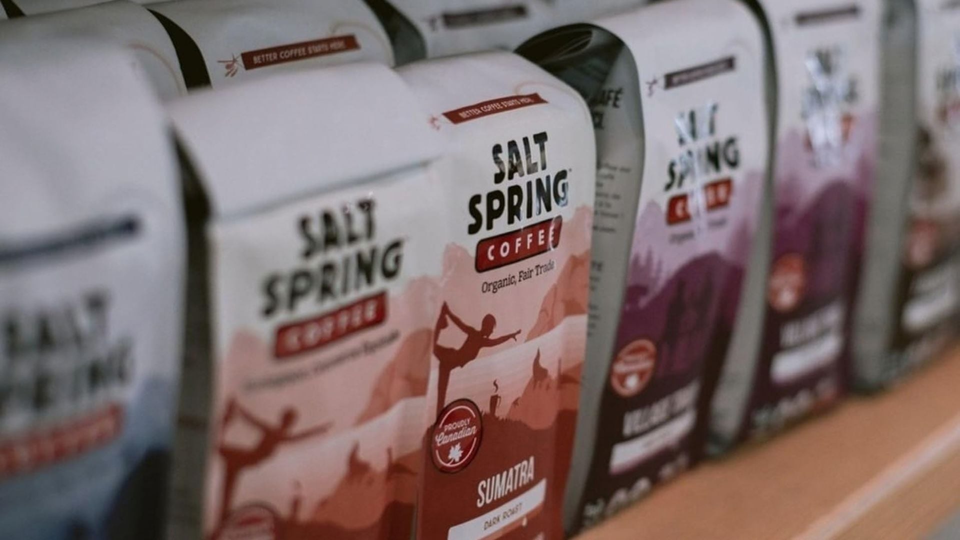 bags of coffee grounds on a store shelf