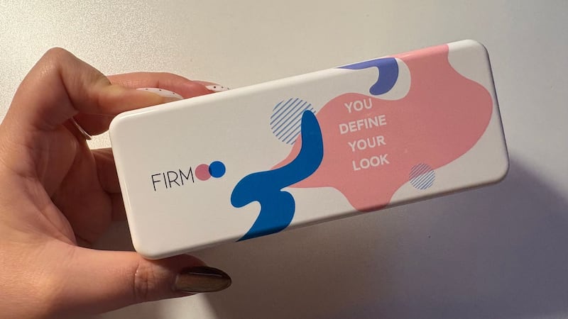 Bianca holding the hardshell case with the glasses inside