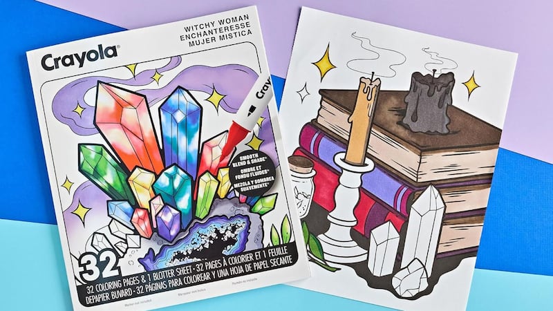 A witchy Crayola colouring book next to a half-shaded-in image of spellbooks.