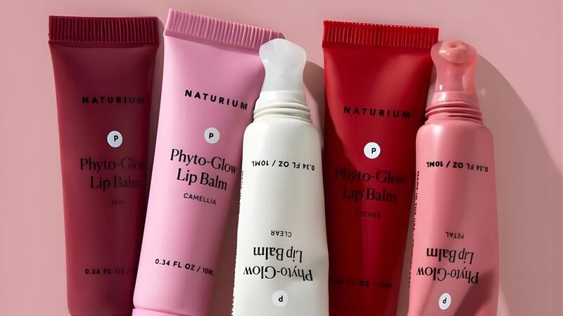 a bunch of the gloss tubes lined up with a bright plain background