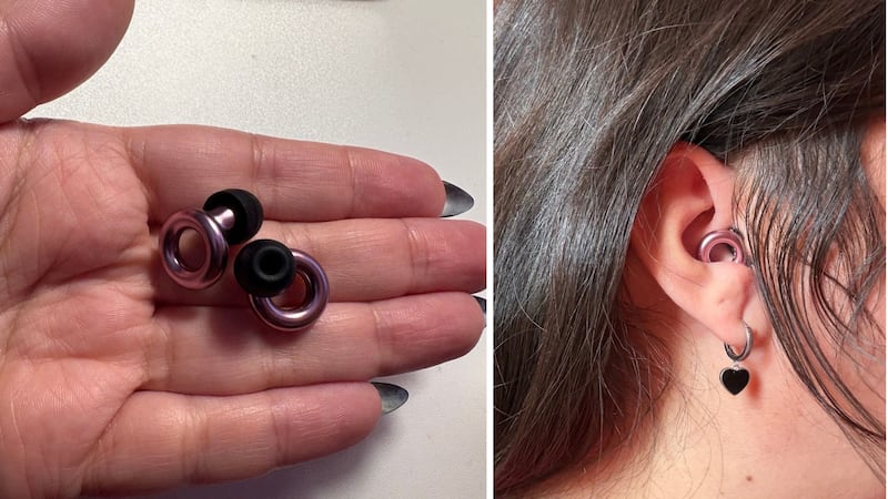 the ear plugs in Bianca's hand, and one of them in her ear
