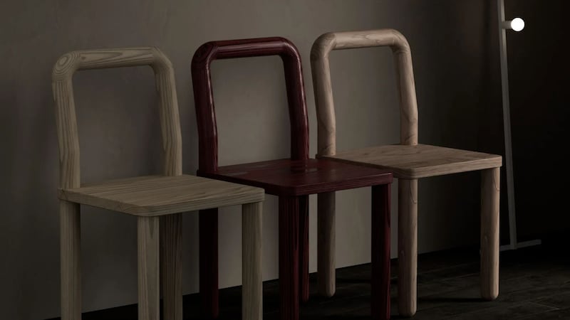 three chairs against a dark wall