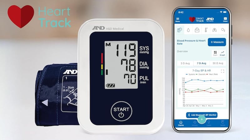 A blood pressure monitor and a phone showing health metrics.