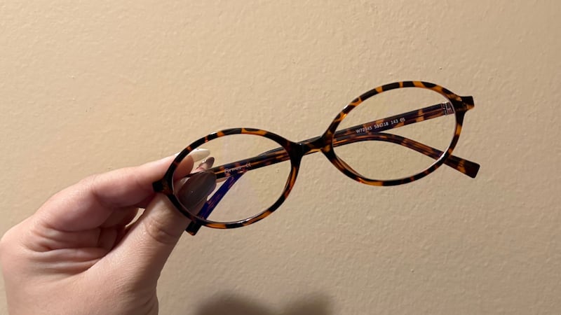 Bianca holding the glasses up