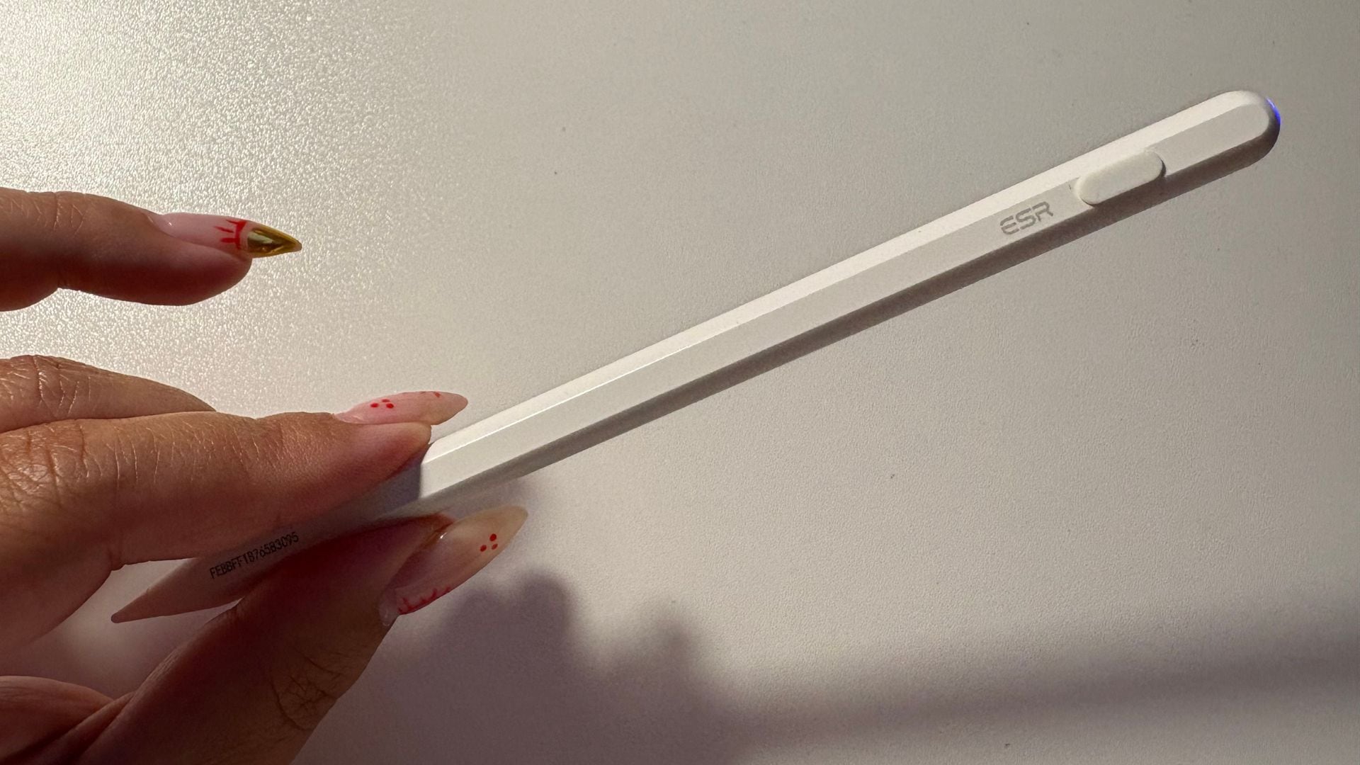 Bianca holding the pencil over her desk