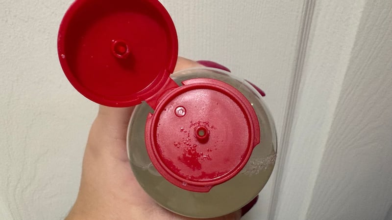 The top of bottle and small spout on the Thayers toner