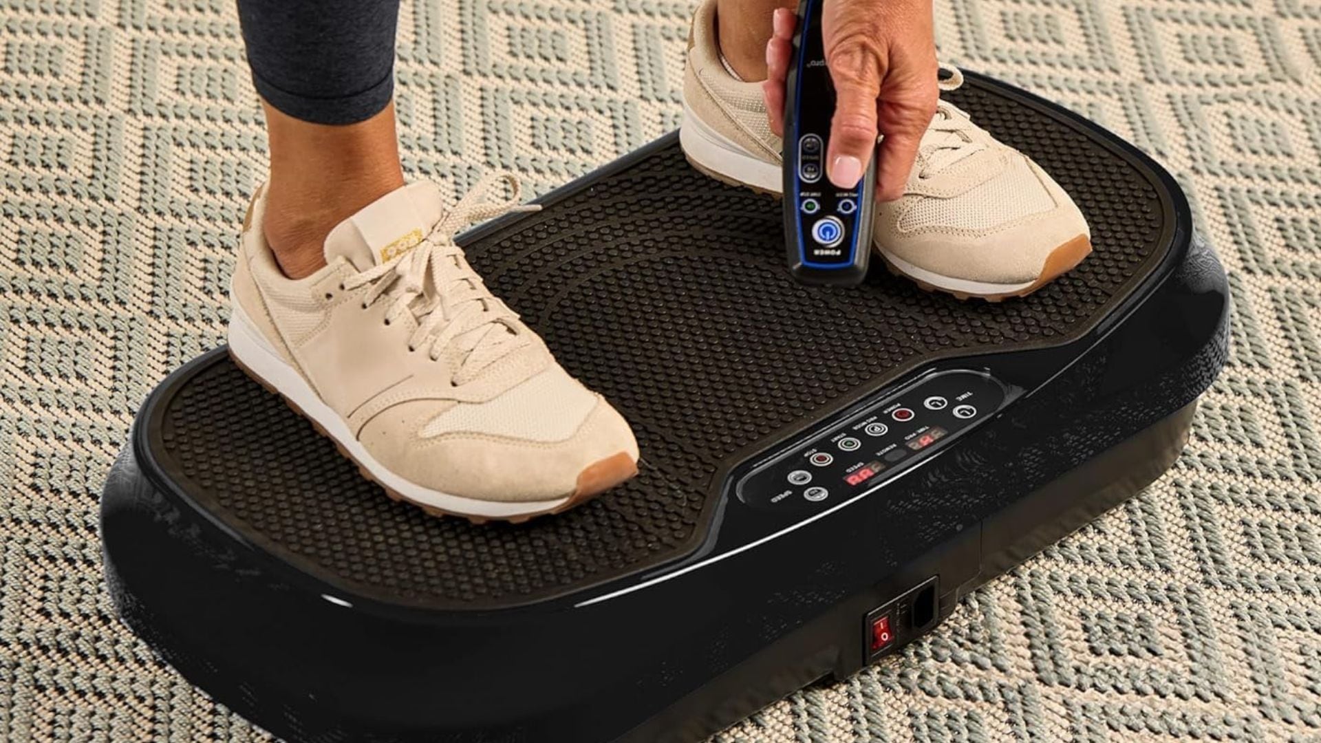 A person standing on a vibration plate.