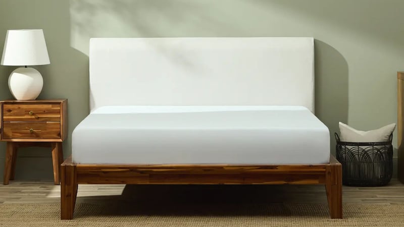 a bed frame and headboard in a bedroom