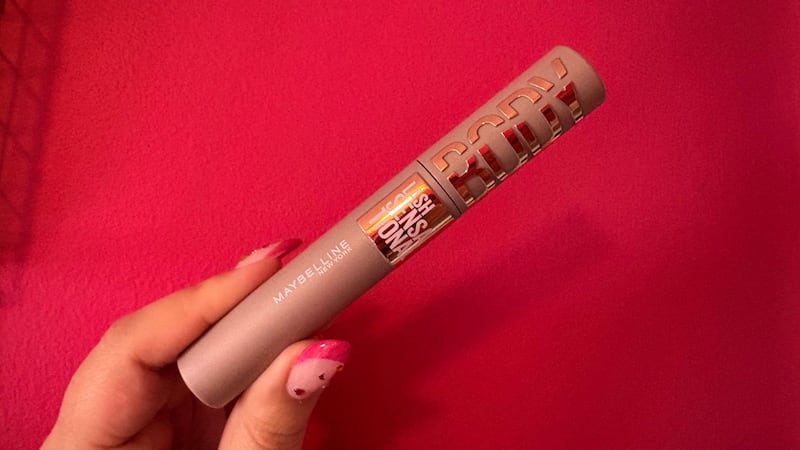 Bianca holding the tube of mascara