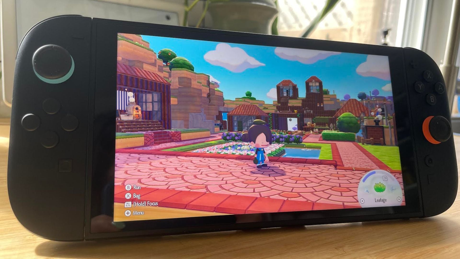 Alice's Nintendo Switch 2 is displaying a scene from Pokopia.