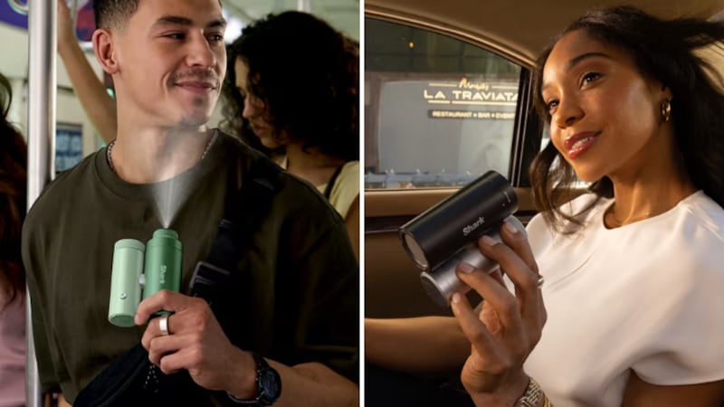 Man cooling himself with the mist option and woman holding it with the fan option